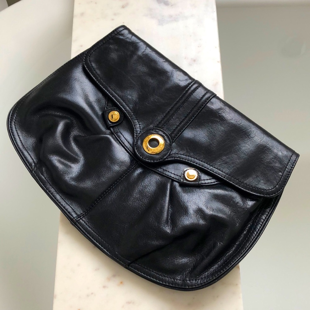 Perlina leather black clutch with gold detailing